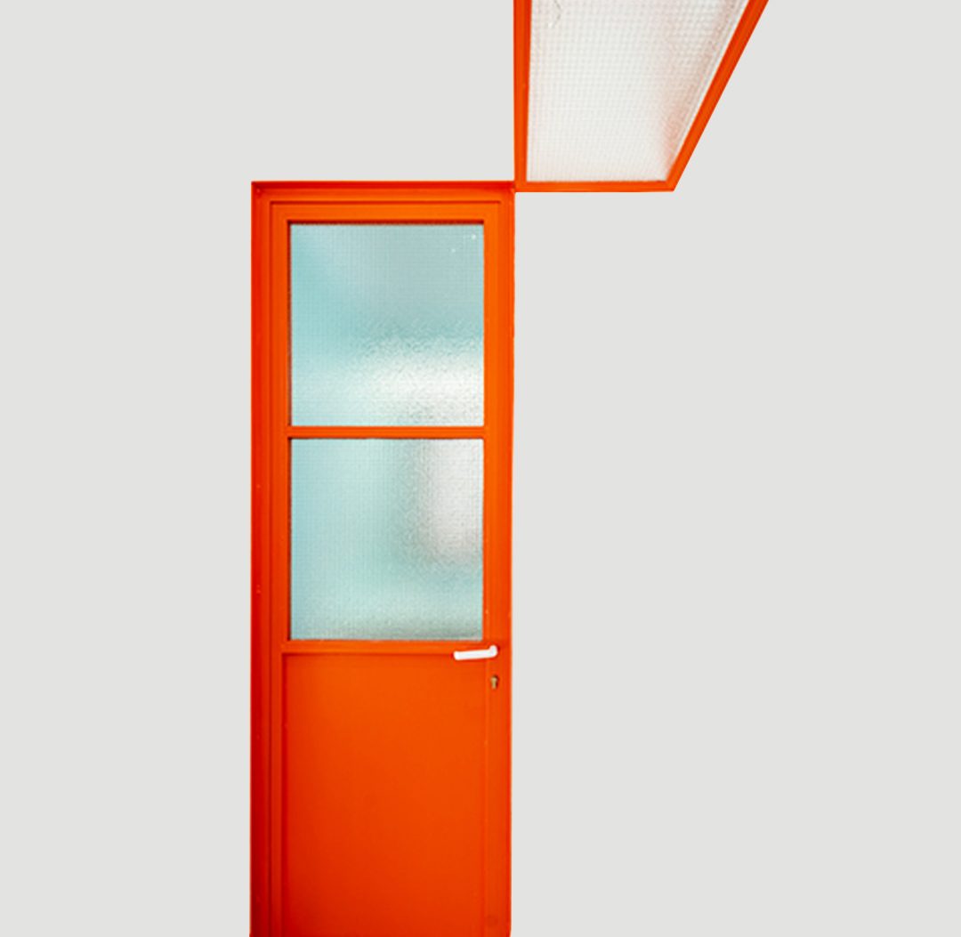 Renovation of an apartment in Kypseli: bold orange door